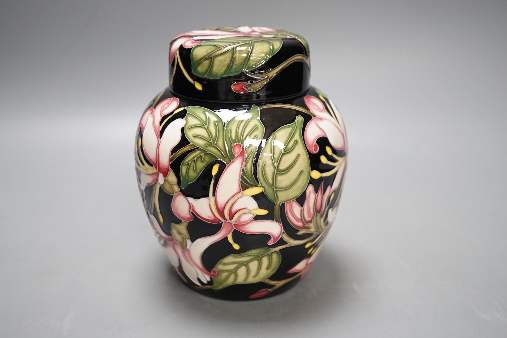 A Moorcroft 'Karzai honeysuckle' jar and cover, by Kerry Goodwin, numbered edition 769/6, 2012, boxed, 15 cms high.